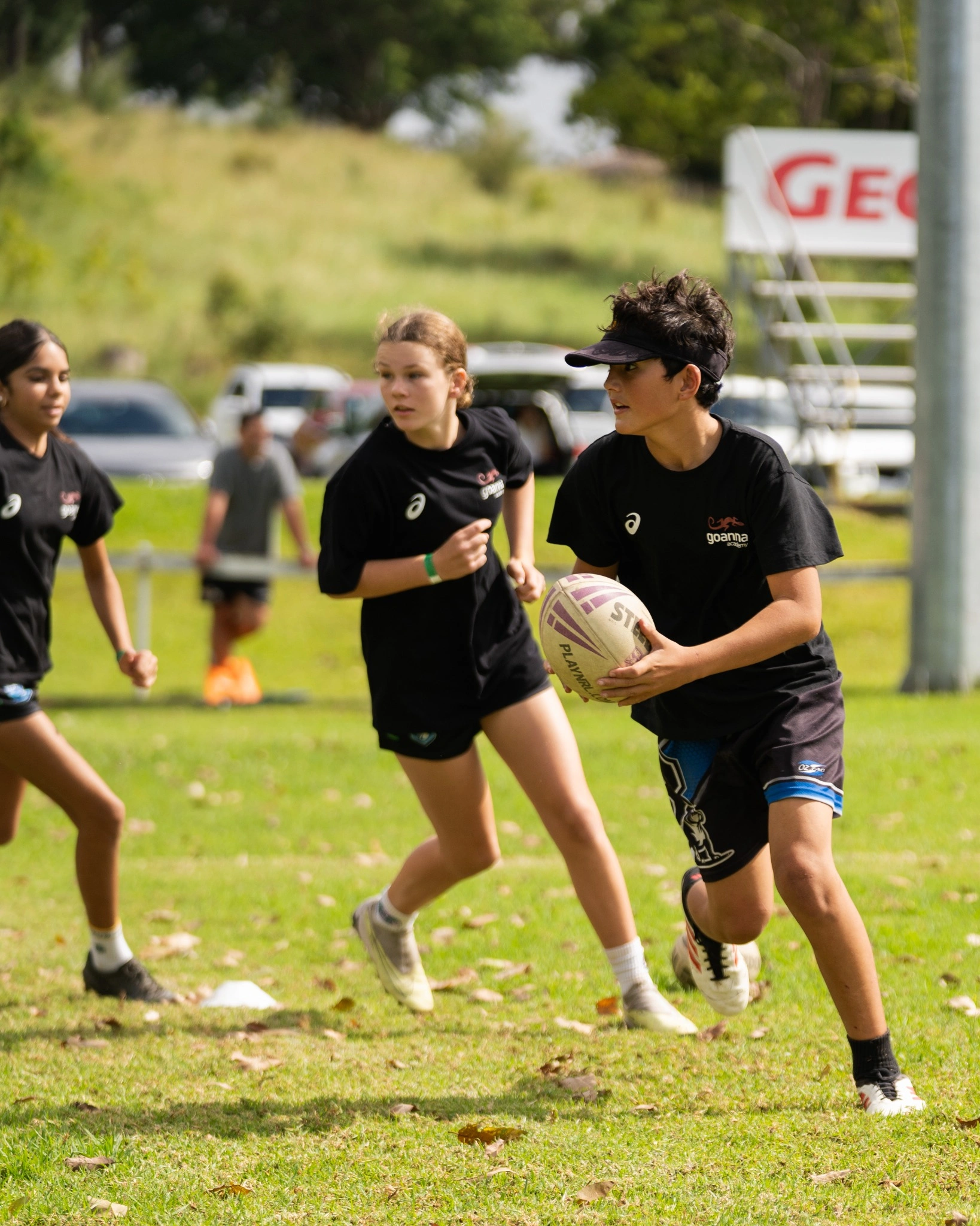 Youth running drills during rugby clinic