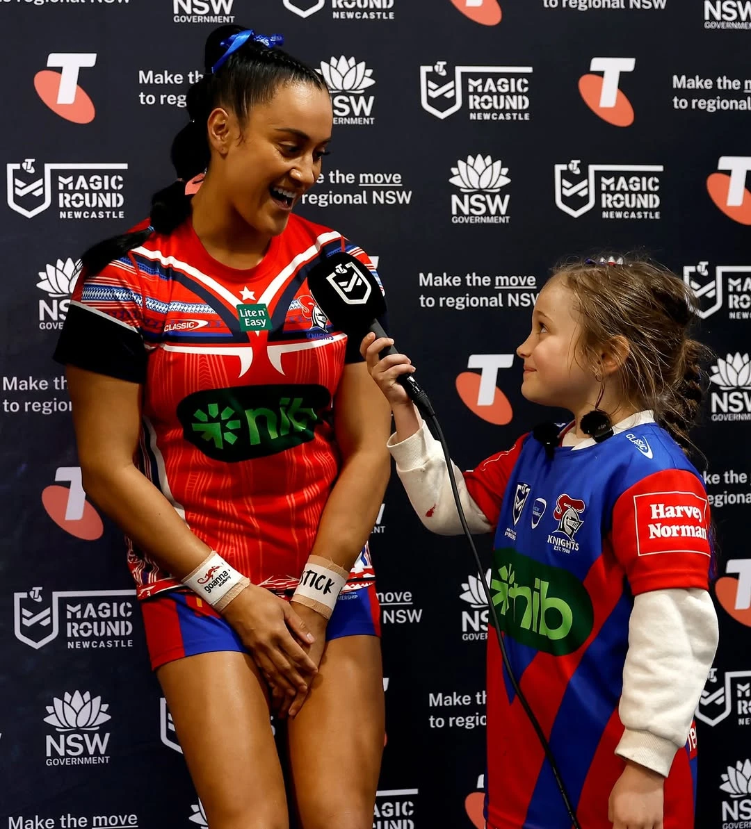 Rugby Coach talking to young athlete